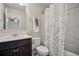 Bathroom with modern fixtures, dragonfly shower curtain, and neutral walls at 3610 Ansley Manor Ct, Cumming, GA 30028