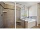 Bathroom with walk-in shower, separate tub, and tiled shower at 3610 Ansley Manor Ct, Cumming, GA 30028