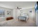 Bedroom with lots of natural light, neutral carpet, and ceiling fan at 3610 Ansley Manor Ct, Cumming, GA 30028