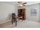 Bedroom or office with a wooden desk, leather office chair, and a wooden hutch with shelves and drawers at 3610 Ansley Manor Ct, Cumming, GA 30028