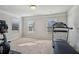 Bright and airy exercise room with natural light and space for exercise equipment at 3610 Ansley Manor Ct, Cumming, GA 30028