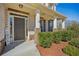 Inviting front porch features stone pillars and lush landscaping at 3610 Ansley Manor Ct, Cumming, GA 30028