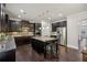 Spacious kitchen featuring a central island, granite countertops, and stainless steel appliances at 3610 Ansley Manor Ct, Cumming, GA 30028