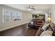 Bright living room featuring dark hardwood floors, comfortable seating and a view of the backyard at 3610 Ansley Manor Ct, Cumming, GA 30028