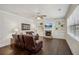Comfortable living room with a fireplace and built-in shelving at 3610 Ansley Manor Ct, Cumming, GA 30028