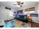 This bedroom features a futon, unique wall decor, and a ceiling fan at 4970 Lost Mountain Nw Trce, Kennesaw, GA 30152