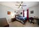 Comfortable bedroom with carpeted floors, ceiling fan, window, and decorative posters at 4970 Lost Mountain Nw Trce, Kennesaw, GA 30152