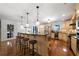 Spacious eat-in kitchen featuring a large island with bar stool seating and updated stainless steel appliances at 4970 Lost Mountain Nw Trce, Kennesaw, GA 30152