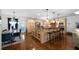 Gourmet kitchen featuring granite countertops, stainless steel appliances, and a breakfast bar at 4970 Lost Mountain Nw Trce, Kennesaw, GA 30152