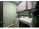 Functional laundry room with modern washer and dryer, plus convenient shelving at 4970 Lost Mountain Nw Trce, Kennesaw, GA 30152