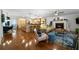 Spacious living room with hardwood floors, fireplace, and seamless flow to kitchen and dining areas at 4970 Lost Mountain Nw Trce, Kennesaw, GA 30152