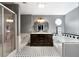 Main bathroom offers double sink vanity, a shower with glass door, and a soaking tub at 4970 Lost Mountain Nw Trce, Kennesaw, GA 30152
