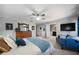 Large main bedroom featuring a ceiling fan, large closet, and a seating area with TV at 4970 Lost Mountain Nw Trce, Kennesaw, GA 30152