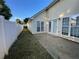 Exterior backyard view with white fence, patio and freshly cut grass at 536 Highland Falls Dr, Hiram, GA 30141