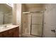 Bathroom with vanity, shower with sliding glass doors and white walls at 536 Highland Falls Dr, Hiram, GA 30141