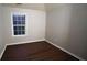 Bedroom features hardwood floors, a bright window and neutral walls at 536 Highland Falls Dr, Hiram, GA 30141
