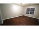 Bedroom features hardwood floors, a bright window and neutral walls at 536 Highland Falls Dr, Hiram, GA 30141