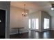Spacious dining area with chandelier lighting and access to the patio at 536 Highland Falls Dr, Hiram, GA 30141