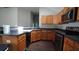 Functional kitchen with stainless steel appliances and wood cabinetry at 536 Highland Falls Dr, Hiram, GA 30141