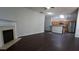 Open-concept living area with fireplace and kitchen with stainless steel appliances at 536 Highland Falls Dr, Hiram, GA 30141