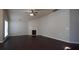 Bright living room with a fireplace, large windows, and dark wood floors at 536 Highland Falls Dr, Hiram, GA 30141