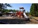 Community playground with slides, climbing structures, and a swing set at 536 Highland Falls Dr, Hiram, GA 30141
