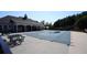 Community pool covered with a mesh winter safety cover, ready for colder months at 536 Highland Falls Dr, Hiram, GA 30141