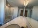 Dual sink vanity area in a bathroom featuring a walk-in shower with marble-look tile at 400 Renwood Trl, Johns Creek, GA 30097