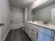 Modern bathroom featuring double sink vanity, ample storage and tiled floors at 400 Renwood Trl, Johns Creek, GA 30097