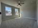 Bright bedroom with ample natural light through the home's well-placed windows at 400 Renwood Trl, Johns Creek, GA 30097