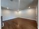 Hardwood floor in this bonus room with recessed lighting, perfect for entertaining at 400 Renwood Trl, Johns Creek, GA 30097