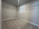 Walk-in closet with wire shelving ready for organizing clothes and accessories at 400 Renwood Trl, Johns Creek, GA 30097