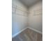 Walk-in closet with wire shelving to maximize storage and organization at 400 Renwood Trl, Johns Creek, GA 30097
