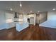 Modern kitchen with white cabinets, stainless steel appliances, and hardwood floors at 400 Renwood Trl, Johns Creek, GA 30097