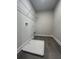 A convenient laundry room with tile flooring and space for washer and dryer at 400 Renwood Trl, Johns Creek, GA 30097