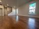 Spacious living room area with hardwood floors and plenty of natural light at 400 Renwood Trl, Johns Creek, GA 30097