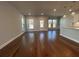 Large open concept living room with hardwood floors, natural lighting and neutral colors at 400 Renwood Trl, Johns Creek, GA 30097