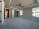 Spacious main bedroom features tray ceilings, large windows and plush carpeting at 400 Renwood Trl, Johns Creek, GA 30097