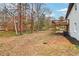 Spacious backyard view with a wooden deck attached to the side of the two-story home at 5901 Miller Rd, Austell, GA 30106