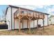 Exterior shot of the spacious wooden deck attached to the house, perfect for outdoor entertaining and enjoying the backyard at 5901 Miller Rd, Austell, GA 30106