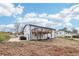 View of the house with a raised wooden deck, showcasing the backyard's potential for landscaping and outdoor activities at 5901 Miller Rd, Austell, GA 30106