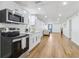 Finished basement with modern kitchen and open floor plan at 5901 Miller Rd, Austell, GA 30106