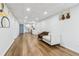 Spacious basement with light wood floors, white walls, and access to a kitchenette, offering ample room for various uses at 5901 Miller Rd, Austell, GA 30106