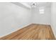 Inviting bedroom with wood floors and a contemporary chandelier, offering a serene atmosphere for relaxation and rest at 5901 Miller Rd, Austell, GA 30106