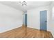 Bright, spacious bedroom featuring beautiful hardwood floors and a classic light fixture at 5901 Miller Rd, Austell, GA 30106