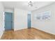 Light filled bedroom with two doors and wood floors at 5901 Miller Rd, Austell, GA 30106