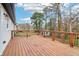 Wide plank wooden deck with black metal railings overlooking the backyard at 5901 Miller Rd, Austell, GA 30106