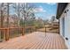 Spacious wooden deck with black metal railings leading to a sliding glass door entrance at 5901 Miller Rd, Austell, GA 30106