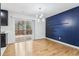 Dining area highlighting hardwood floors, modern lighting, and sliding door to the deck area at 5901 Miller Rd, Austell, GA 30106