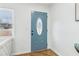 Bright foyer featuring a stylish front door, hardwood floors, and ample natural light at 5901 Miller Rd, Austell, GA 30106